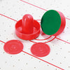 Close-up of 2 pushers and 2 pucks included with the E-Jet Games Table Top Air Powered Hockey Game