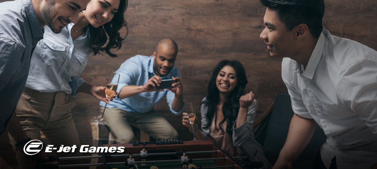  Group of young adults playing foosball